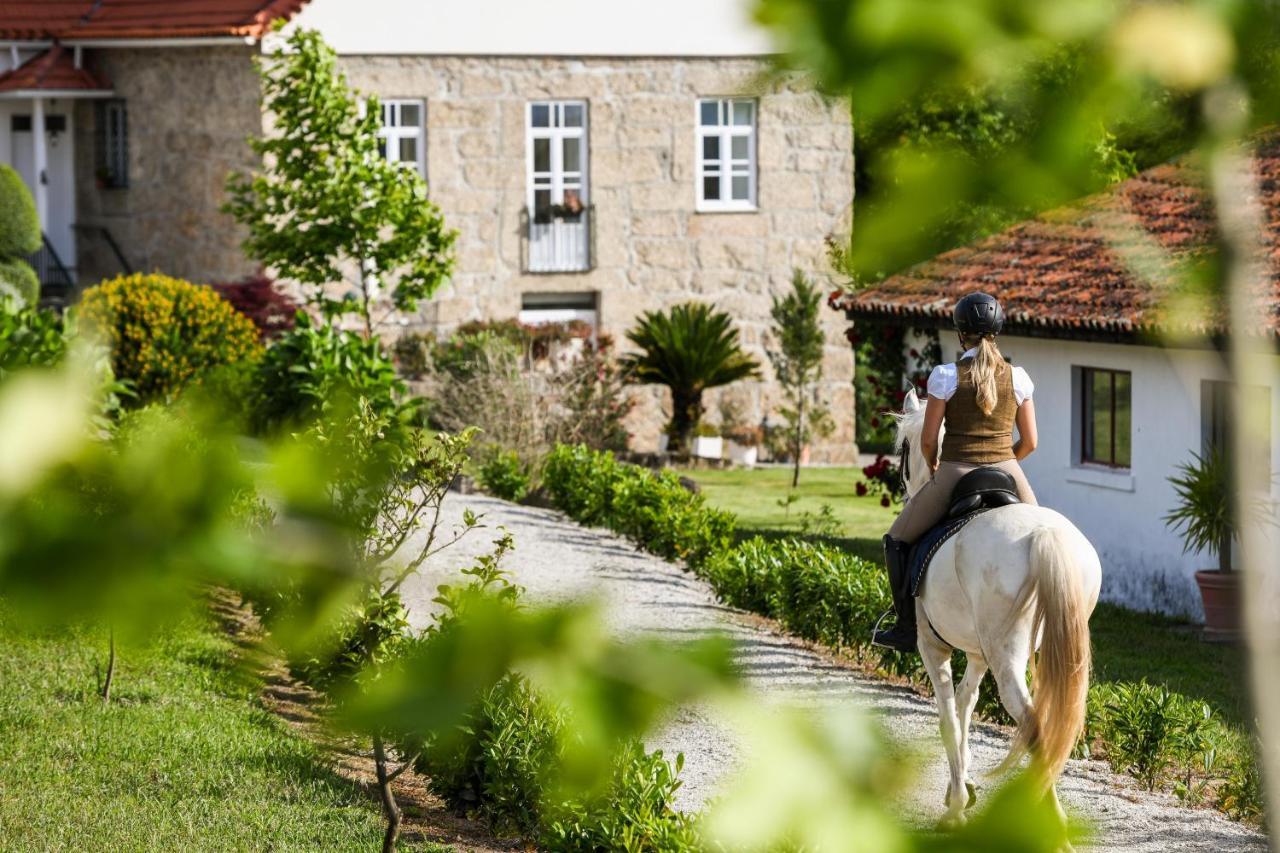 Woman riding towards a beautiful building in Portugal.